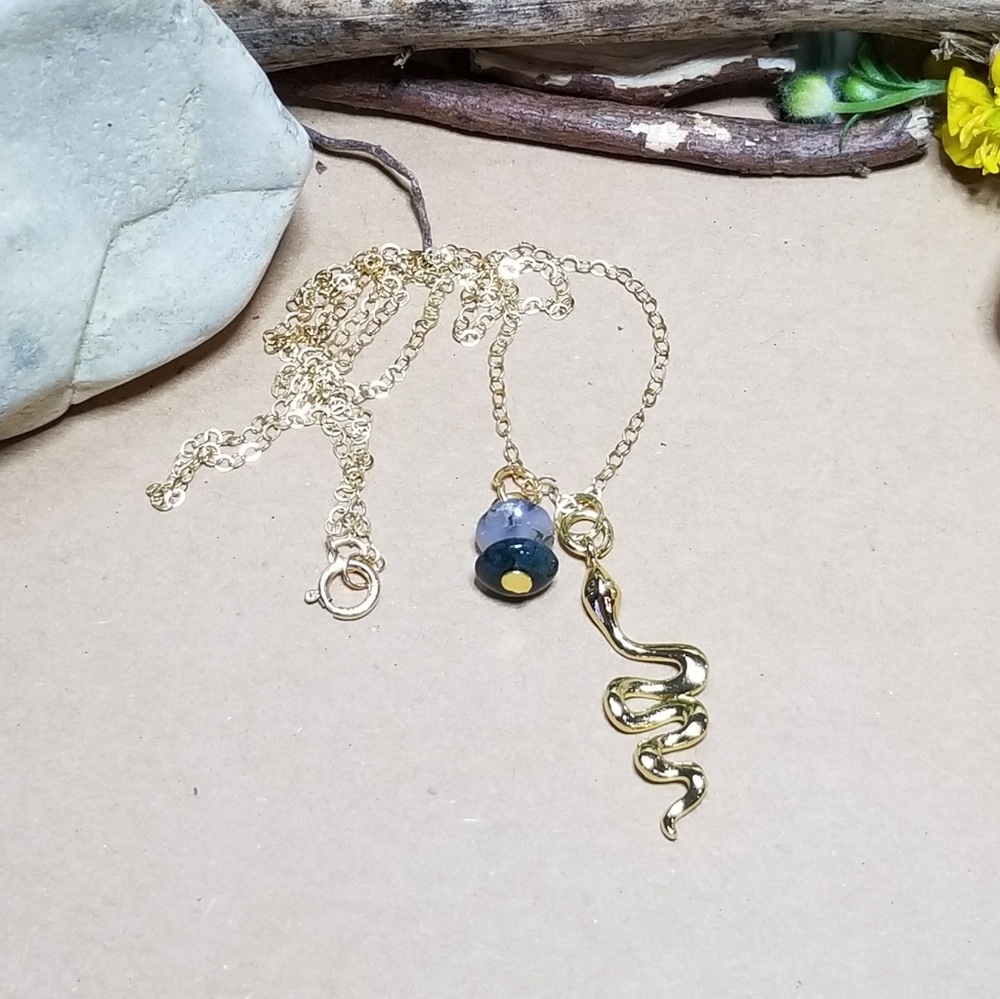 Gold necklace with Serpent charm